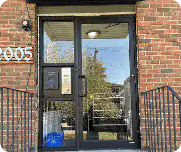 Homepage 23 Secure glass entry door replacement for apartment building, completed under commercial door repairs Calgary.