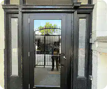 Homepage 21 Black aluminum double entrance restored as part of commercial door repairs Calgary project.
