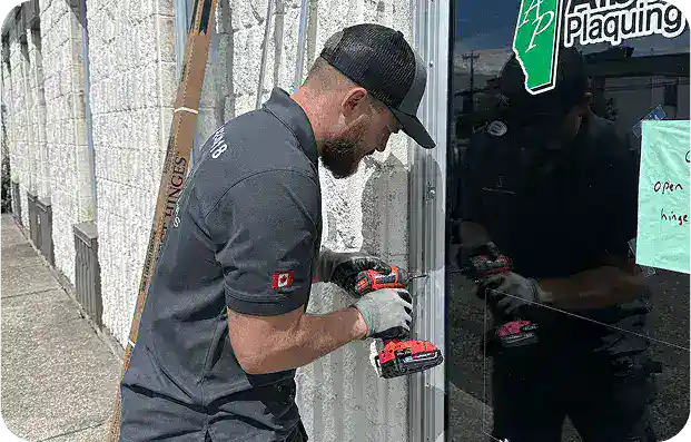 Homepage 28 Expert technician using tools to complete precise commercial door repairs Calgary service. Image Title: Automatic Handicap Accessible Door