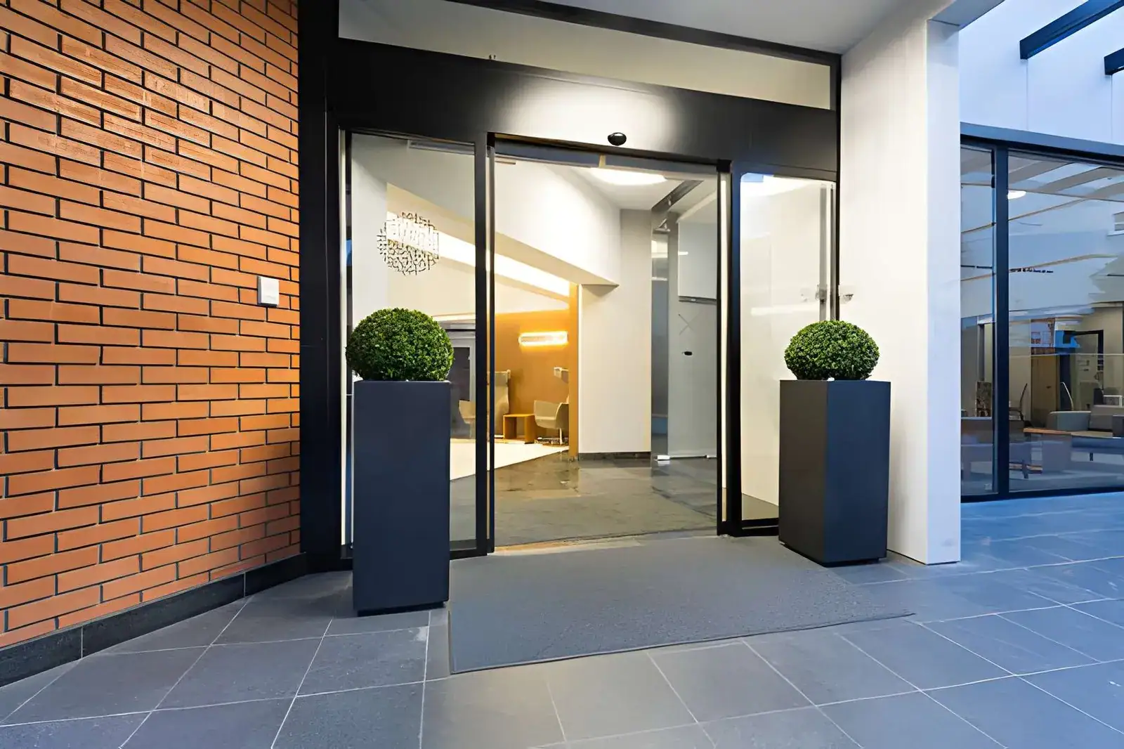 Commercial Glass Door Repair replacing damaged commercial glass entry panel